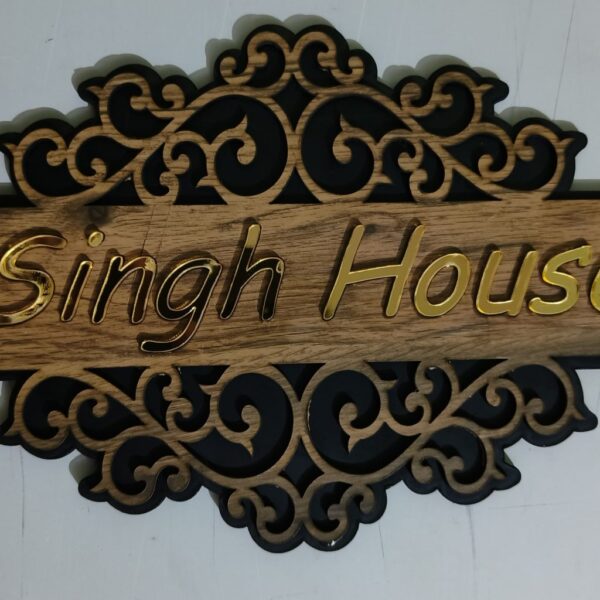 Wooden name plate with acrylic lettering for a stylish touch.